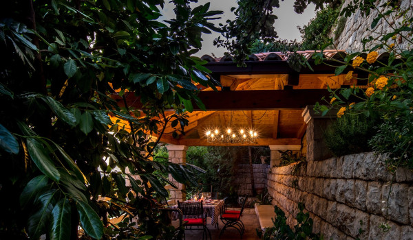 Outside dining table on the terrace of the luxury vacation villa Dubrovnik Palace with concierge service