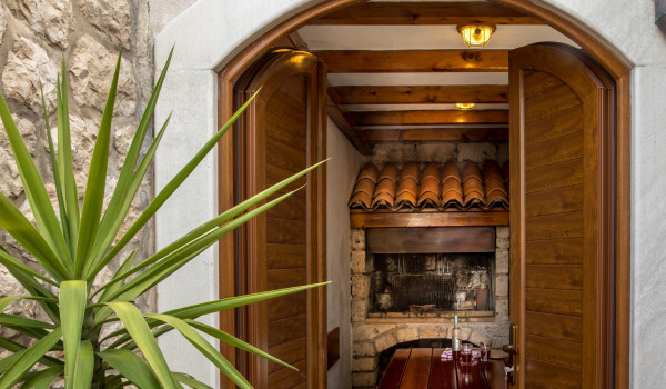 Traditional “konoba” with grill of Croatia luxury seafront villa for vacation with family and friends in Dubrovnik