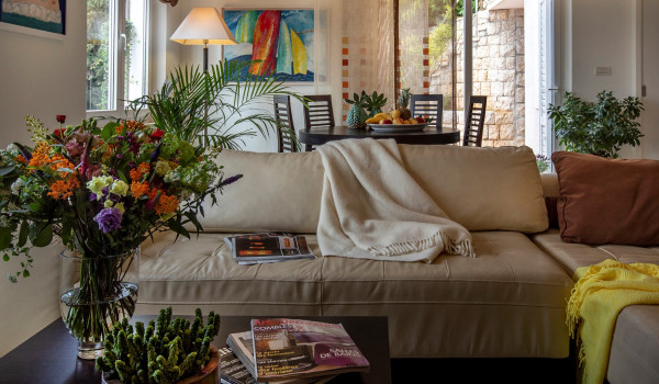 Comfortable sofa in the living room of the luxury vacation villa with private pool and parking