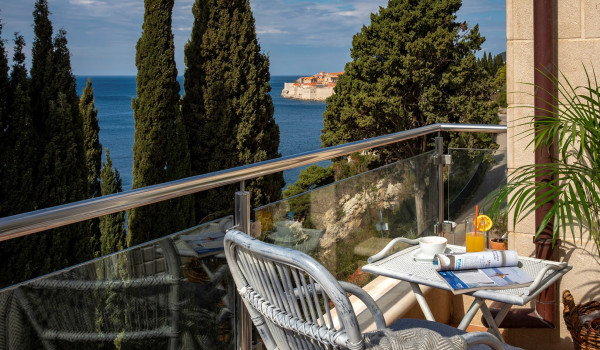 Rustic chair on the terrace overlooking the sea of the Dubrovnik luxury villa at the beach with concierge service