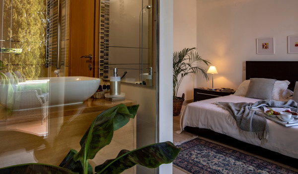 En suite bathroom in the bedroom with king size bed in a Dubrovnik luxury villa for vacation with family and friends