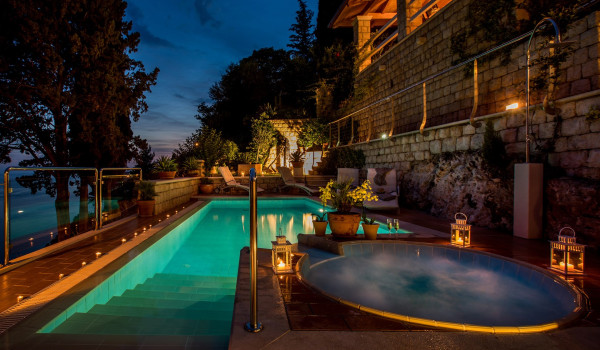 Private pool and jacuzzi on the terrace of the beachfront villa for family vacation by the sea in Dubrovnik