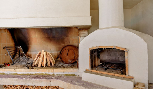 Wood for the fireplace and grill in the summer kitchen of the luxury villa Velvet Bourbon Split