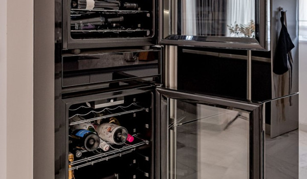 Wine cooler next to the refrigerator in the modern kitchen inside Croatian luxury holiday villa