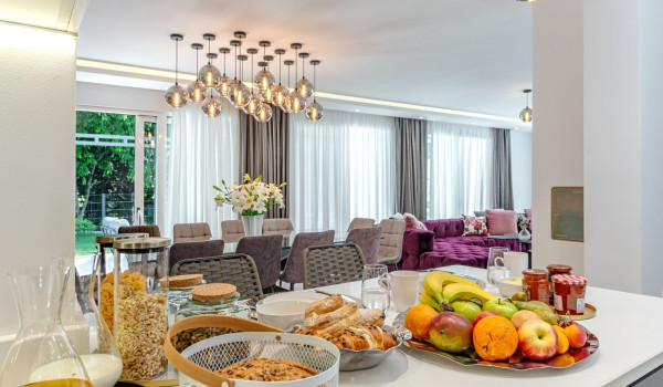 Spacious kitchen island with a served breakfast inside Croatian luxury holiday villa