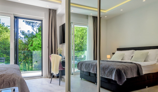 Exit from the bedroom to the terrace next to the LCD TV inside Croatian luxury holiday villa