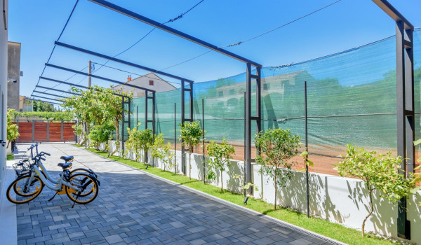 Bicycles parked on the fenced private property of the luxury villa Velvet Bourbon Split