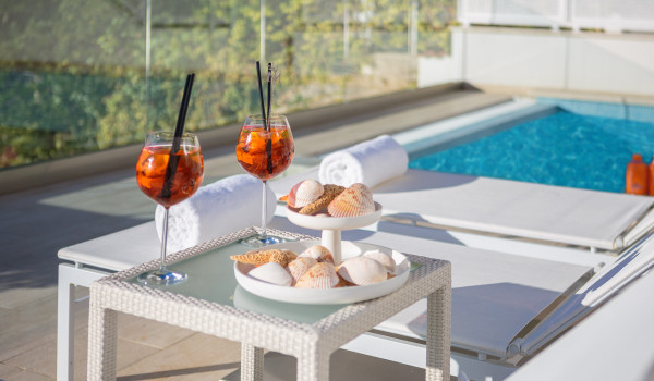 A refreshing drink served on a table by the private pool on the outdoor terrace of Croatia luxury holiday villa Primosten Glamour