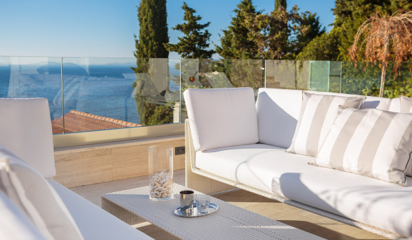 Comfortable seating with a table and a view of the sea on the outdoor terrace of Croatia luxury villa with pool Primosten Glamour