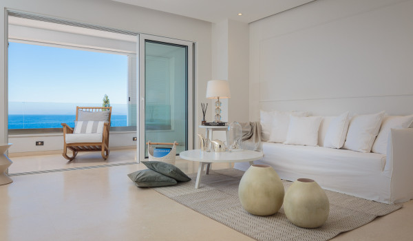 Living room with sofa and access to the balcony of Croatia luxury villa by the sea Primosten Glamour for vacation