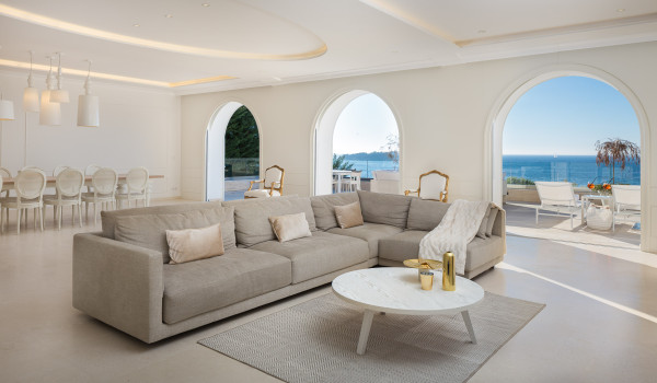 The interior of Croatia pool villa for rent Primosten Glamour with a living room and dining table with chairs