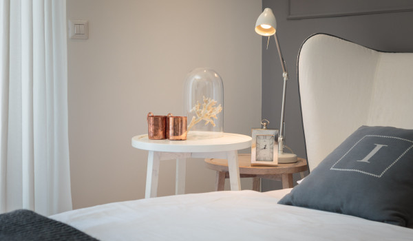 Bedroom of Croatia luxury family villa with double bed and and night stand with lamp for vacation and rent in Primosten