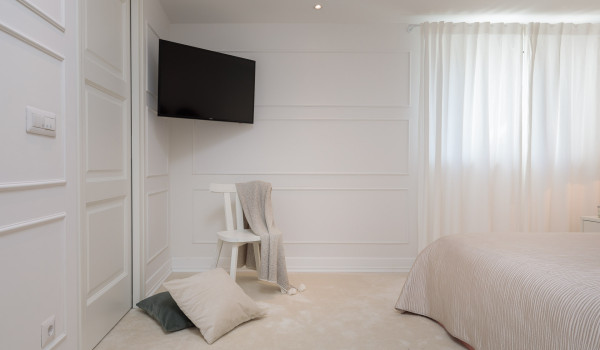 Double bed and LCD TV in the bedroom of the luxury Dalmatia pool villa by the sea in Primosten