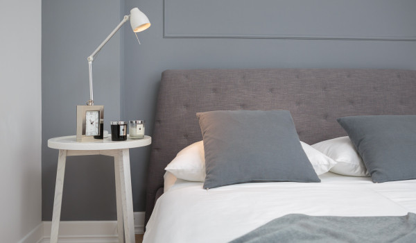 A view of a comfortable double bed of Croatia luxury villa with a private sauna and gym in Primosten