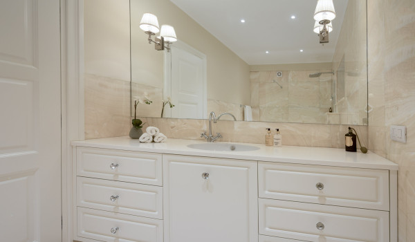 White dressing table with double sink and large mirror in the modern bathroom of Croatia luxury vacation villa in Primosten