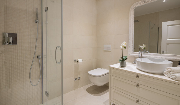 A modern bathroom with a shower cabin and sink with large mirror of Croatia luxury holiday villa in Primosten