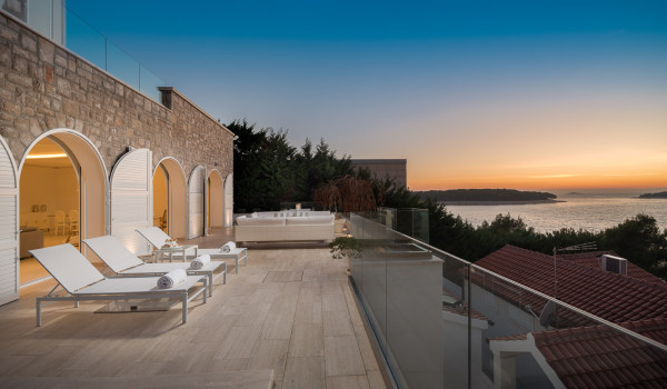 Sunbed with sunbeds on the outdoor terrace with a view of the sea in the luxury Croatia villa for rent in Primosten