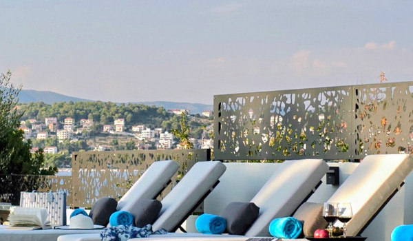 Luxury beachfront villa for rent with 2 pools - deck chairs by the  heated pool