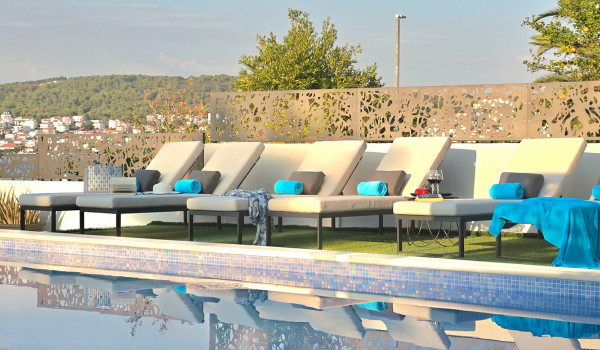 Luxury beachfront villa for rent with 2 pools - deck chairs by the  heated pool