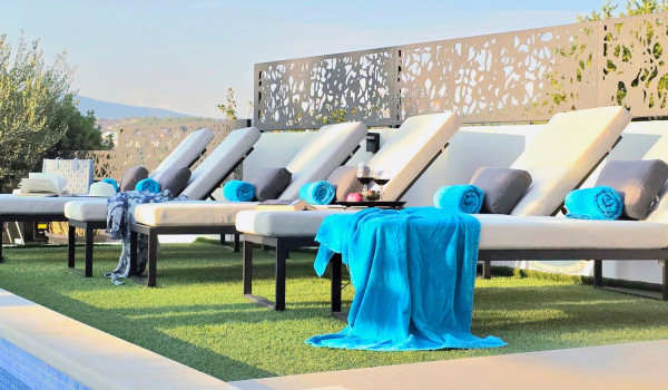 Luxury beachfront villa for rent with 2 pools - deck chairs by the  heated pool