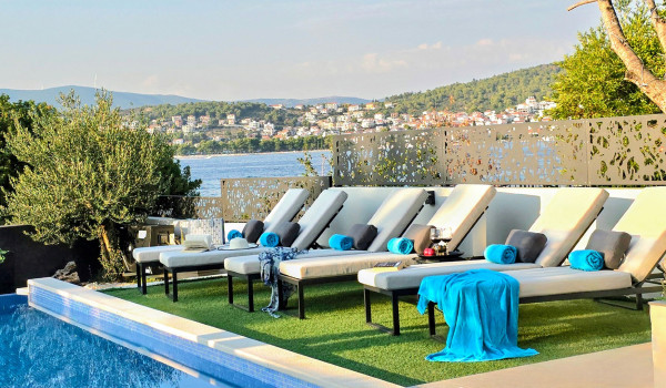 Luxury beachfront villa for rent with 2 pools - deck chairs by the  heated pool