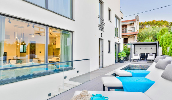 Luxury Beachfront pet friendly villa for 16 pax in Trogir - outdoor heated pool with hydromassage pumps, counter-current swimming, and a waterfall.