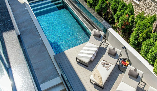 Luxury Beachfront pet friendly villa for 16 pax in Trogir - outdoor heated pool with hydromassage pumps, counter-current swimming, and a waterfall.