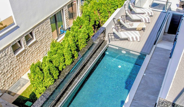 Luxury Beachfront pet friendly villa for 16 pax in Trogir - outdoor heated pool with hydromassage pumps, counter-current swimming, and a waterfall.