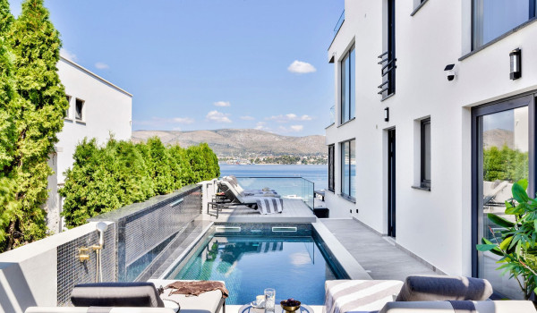 Luxury Beachfront pet friendly villa for 16 pax in Trogir - outdoor heated pool with hydromassage pumps, counter-current swimming, and a waterfall.