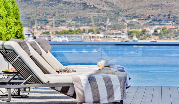 Luxury Beachfront pet friendly villa for 16 pax in Trogir - outdoor heated pool with hydromassage pumps, counter-current swimming, and a waterfall.