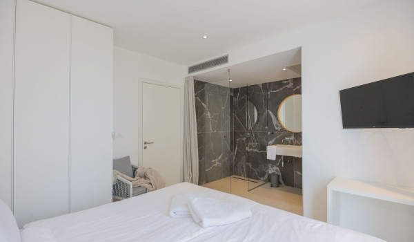 Bedroom with en suite bathroom, double bed and LCD TV in a luxury pool villa for rent and vacation in Brela