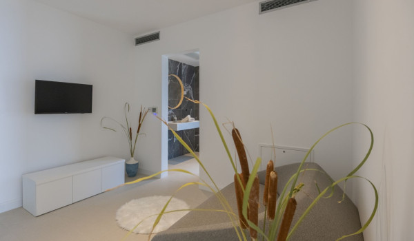 Space for sitting and relaxing with a comfortable sofa, LCD TV in a modern villa by the sea in Brela