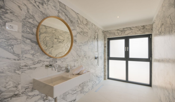 Round modern mirror and sink in the luxury villa for rent and vacation Glorious Brela in Brela