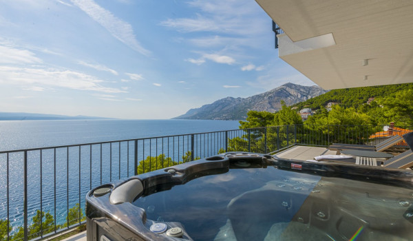 Jacuzzi on the outdoor terrace overlooking the sea in the luxurious villa with private pool Glorious Brela in Brela