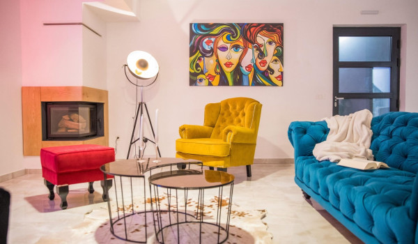 Colourful sofas and fireplace in a living room of a Luxury holiday villa near Dubrovnik with concierge service