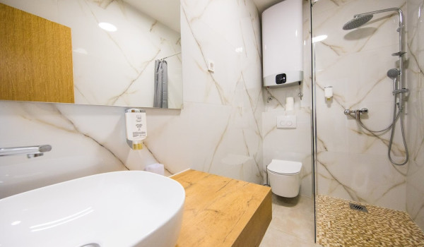 En suite bathroom with walk-in shower of the luxury family villa with concierge service and private parking near Dubrovnik
